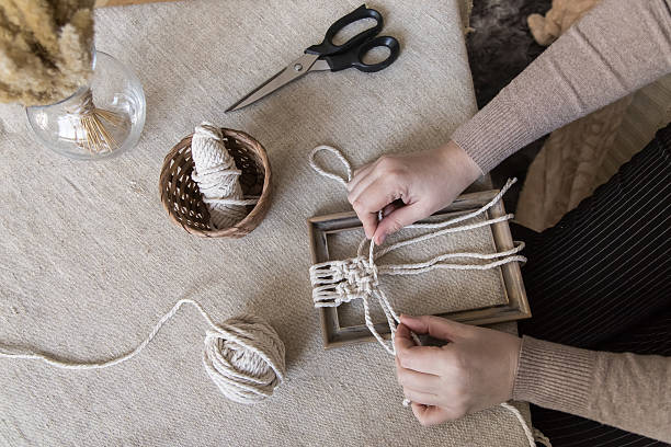 istock Woman Making Macrame Wall Hanging with Natural Cord 2238003885