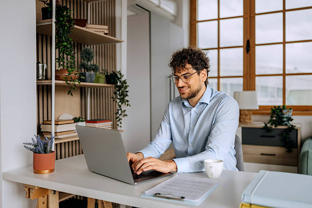 istock Businessman working on laptop in home office 2238005700