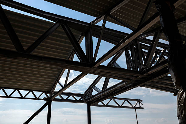 Steel beams of a roof structure in detail on a construction site