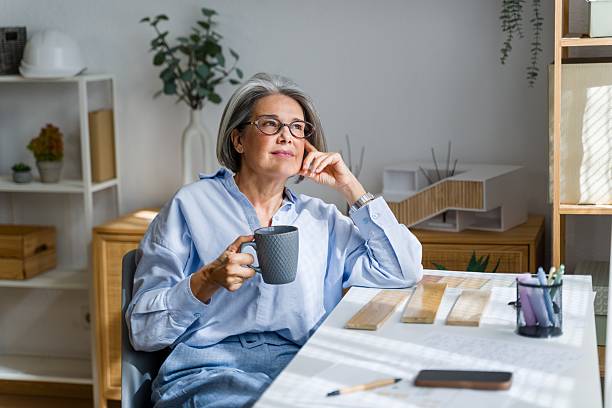 istock Mature female architect thinking about new interior design concepts 2238008548