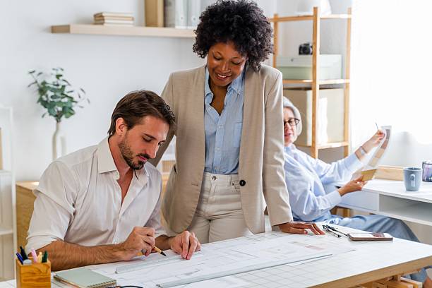istock Diverse architects team working on blueprint in office 2238008626