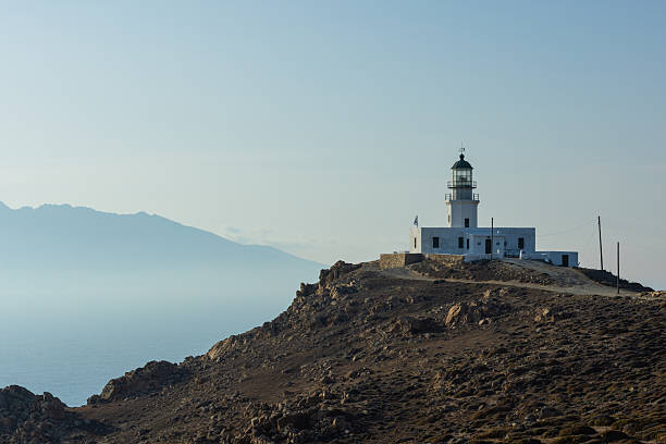 Armenistis Lighthouse at NW part of Mykonos island, Cyclades, Greece in afternoon.