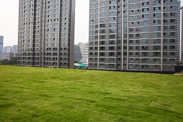 Lawn in front of modern residential complex