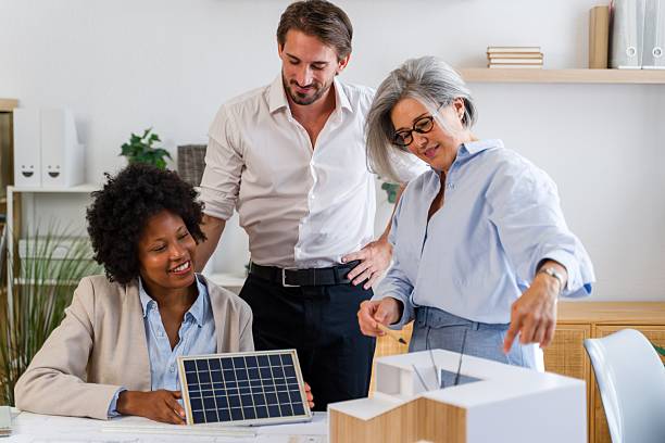istock Architects collaborating on solar energy house model 2238012853