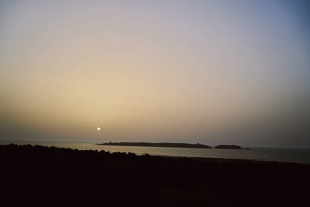 sunset over Essaouira city showing the island
