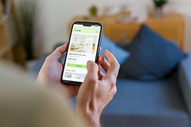 istock Person browsing real estate listings on a smartphone app 2238015140