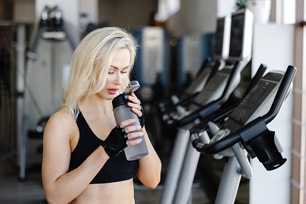 istock Athletic woman hydrating after training in the gym 2238017713