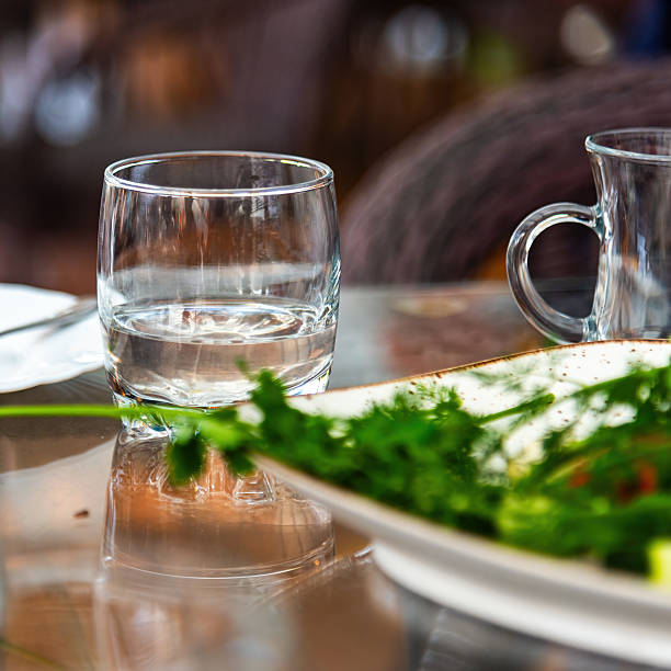 a glass water glass on a restaurant table