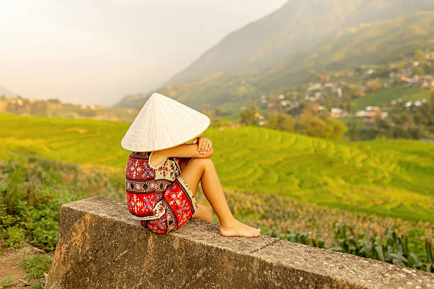 Family with children, cute blond boy, visiting Sapa rice fields on a sunny day