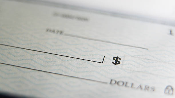 istock Close-Up view of a  blank check on a desk 2238025672