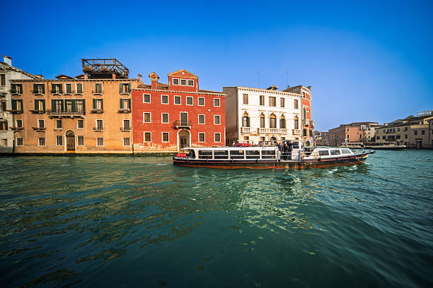 Mouth of Canal Cannaregio, Venice. Vaporettos cross the Grand Canal in afternoon lightreflections shimmer as the city pulses between tradition and tide.