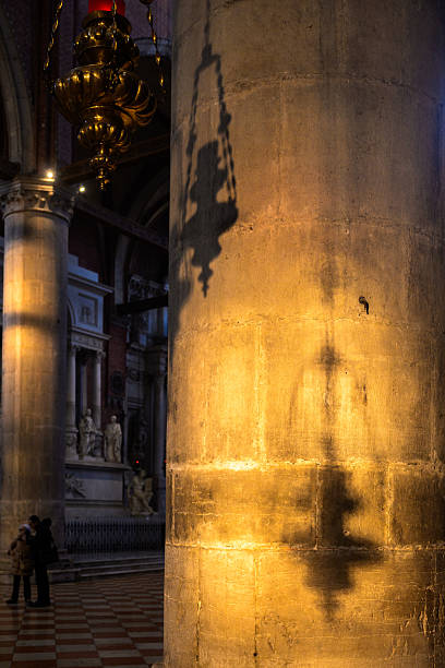 Afternoon light creates shadows on a column in Santa Maria dei Frari