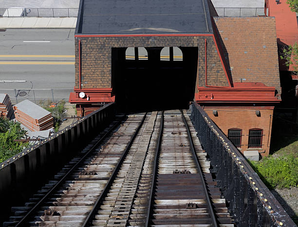 Train tracks going over a bridge.