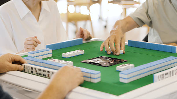 istock Asian elderly people playing mahjong in a care home 2238027768