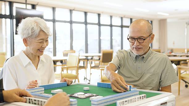 istock Asian elderly people playing mahjong in a care home 2238028513