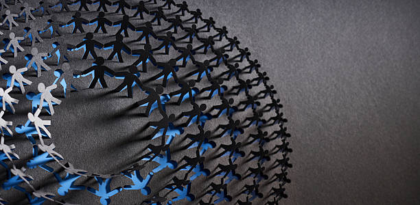 istock Abstract paper sculpture of connected human figures forming a spherical chain 2238029065