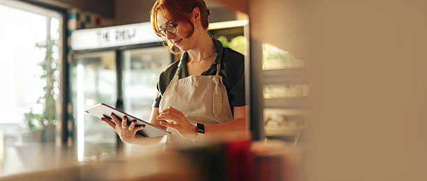 istock Deli owner managing orders on digital tablet 2238029809
