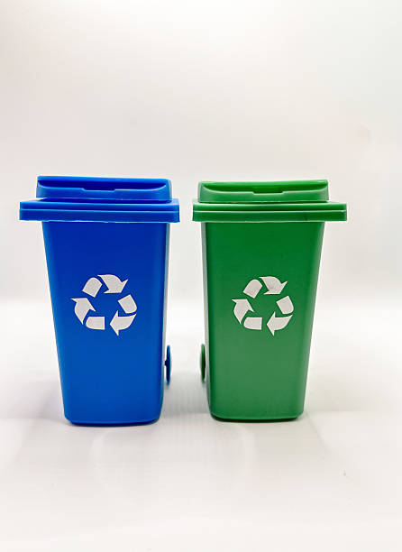 istock Blue and Green Recycling Bins on White Background 2238029818