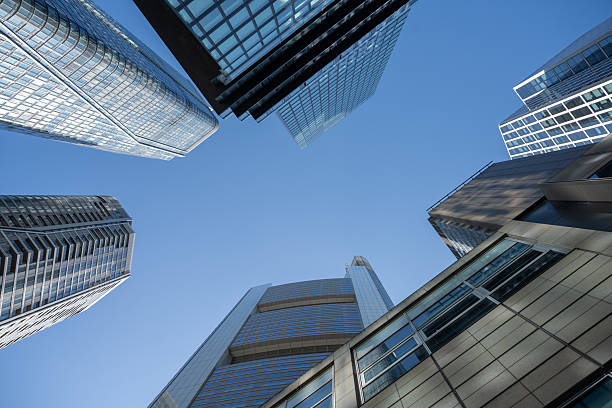 istock Modern skyscrapers and high-rise buildings shot from a low-angle perspective against a clear blue sky 2238032077