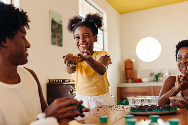 istock Siblings having fun while making traditional brigadeiro in a Brazilian home 2238032140