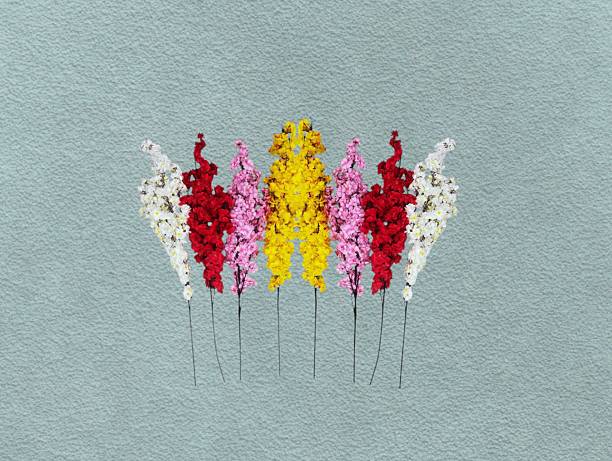 istock Pink, yellow, red plastic flowers 2238032410
