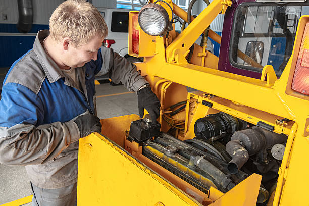 istock Mechanic Working on Heavy Machinery in Workshop 2238032750