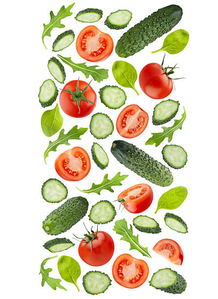 istock Organic vegetable salad ingredients as flying straight flow in art composition, isolated. Red tomatoes, green cucumbers, mixed greens. Vegetarian diet food, detox cooking, fitness diet, advertising. 2238036639