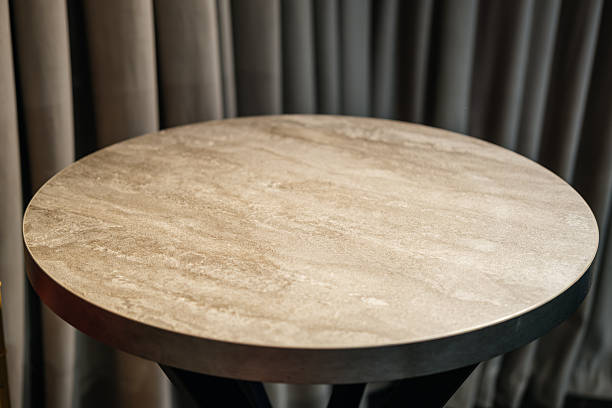 istock An Elegant and Stylish Round Table Featuring a Smooth Surface and a Dark Base Design 2238038182
