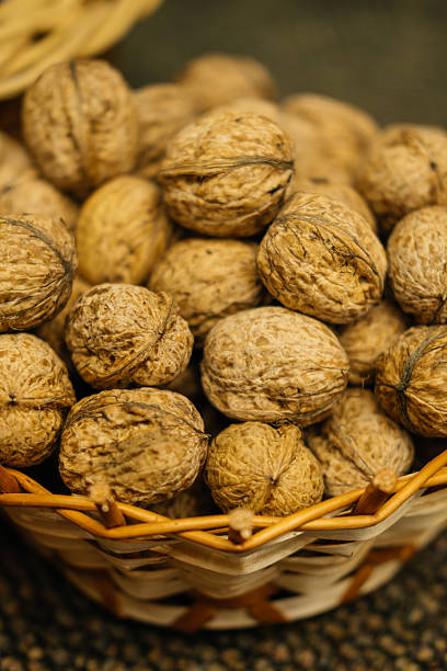 istock A Beautiful Basket Filled with Natural, Fresh Walnuts Still in Their Shells for Enjoyment 2238039659