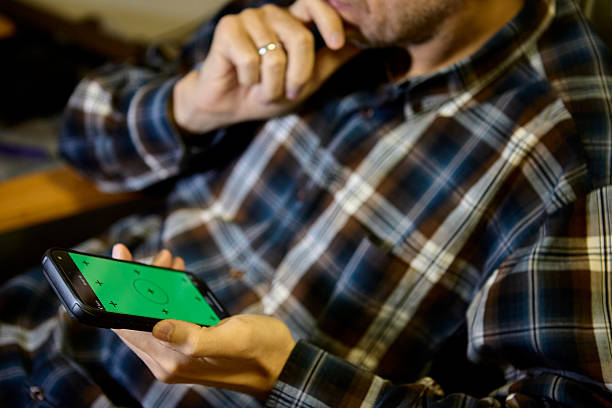 istock Man in plaid shirt using smartphone with hand gesture 2238041537