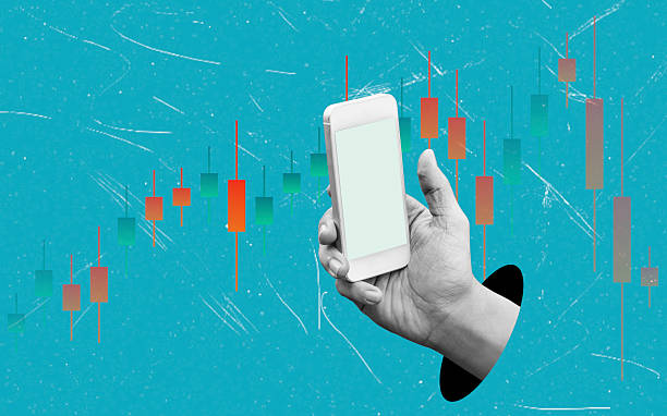 istock Art collage, Trends in mobile trading shown with a hand holding a smartphone surrounded by financial charts in a modern design 2238041982