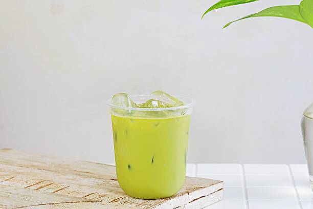 istock Minimalist iced matcha green tea on wooden coaster 2238044289