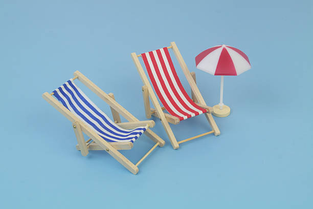 Vacation, beach, travel, relaxation concept. background with blue beach chair on the sand. Minimalism with copy space