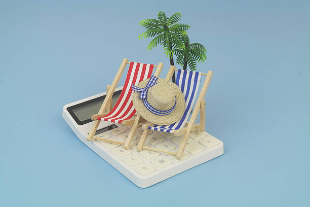 istock Blue and red beach chairs with hat on calculator and palm tree on blue background. 2238048319