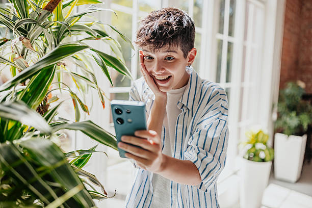 istock Surprised person looking at phone 2238054218