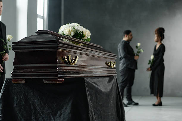 istock Multiethnic Adults Mourning Beside Coffin during Funeral Ceremony Indoors 2238055761