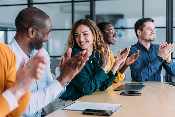 istock Businesspeople applauding during a seminar in conference hall. 2238058278