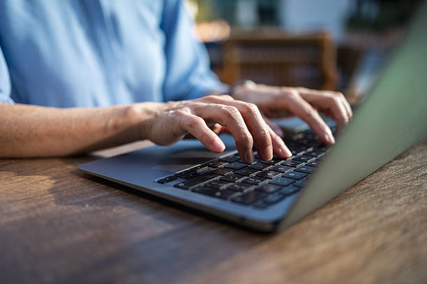 istock Typing on laptop keyboard, working remotely from home 2238058887