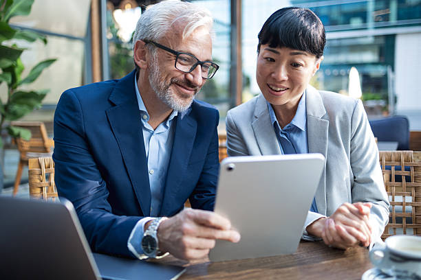 istock Business colleagues discussing project with digital tablet 2238058899
