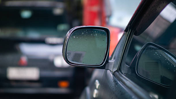istock Car Side Mirror with Raindrops on a Wet Day 2238059558