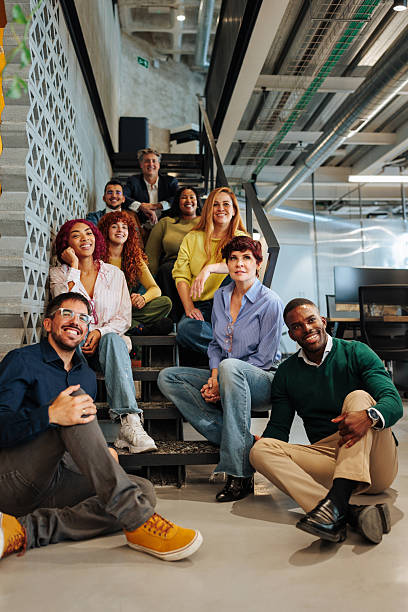 istock Diverse business team sitting on stairs in modern office 2238061435