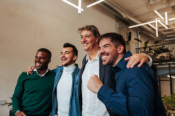 istock Happy business team celebrating success in modern office 2238061436