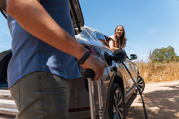 istock Couple charging electric car during road trip 2238062423