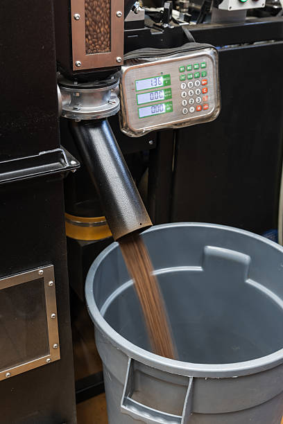 istock Roasted coffee beans just after roasting are fast poured from industrial roaster 2238064807