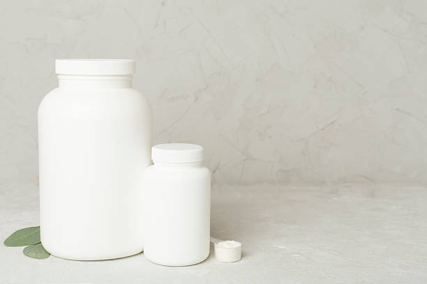 istock Jar with protein powder on concrete background. Sports nutrition concept 2238067708