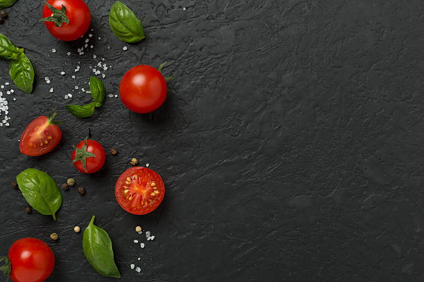 istock Fresh tomatoes, basil, sea salt and spices on concrete background, top view 2238067745
