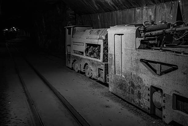 Abandoned Railroad Tracks in a Dark Black Cave, Copy Space, Background