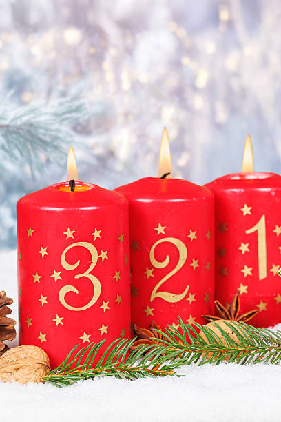 istock Third 3rd Sunday in advent Christmas time copyspace copy space with burning candle snow winter 2238078836