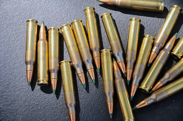 istock long-barreled gun bullets on the table 2238079632