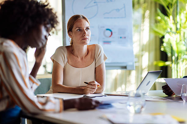 istock Focused Team Members Collaborating During a Business Meeting in a Modern Office 2238079708